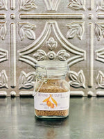 Glass jar filled with Applewood smoked sea salt.