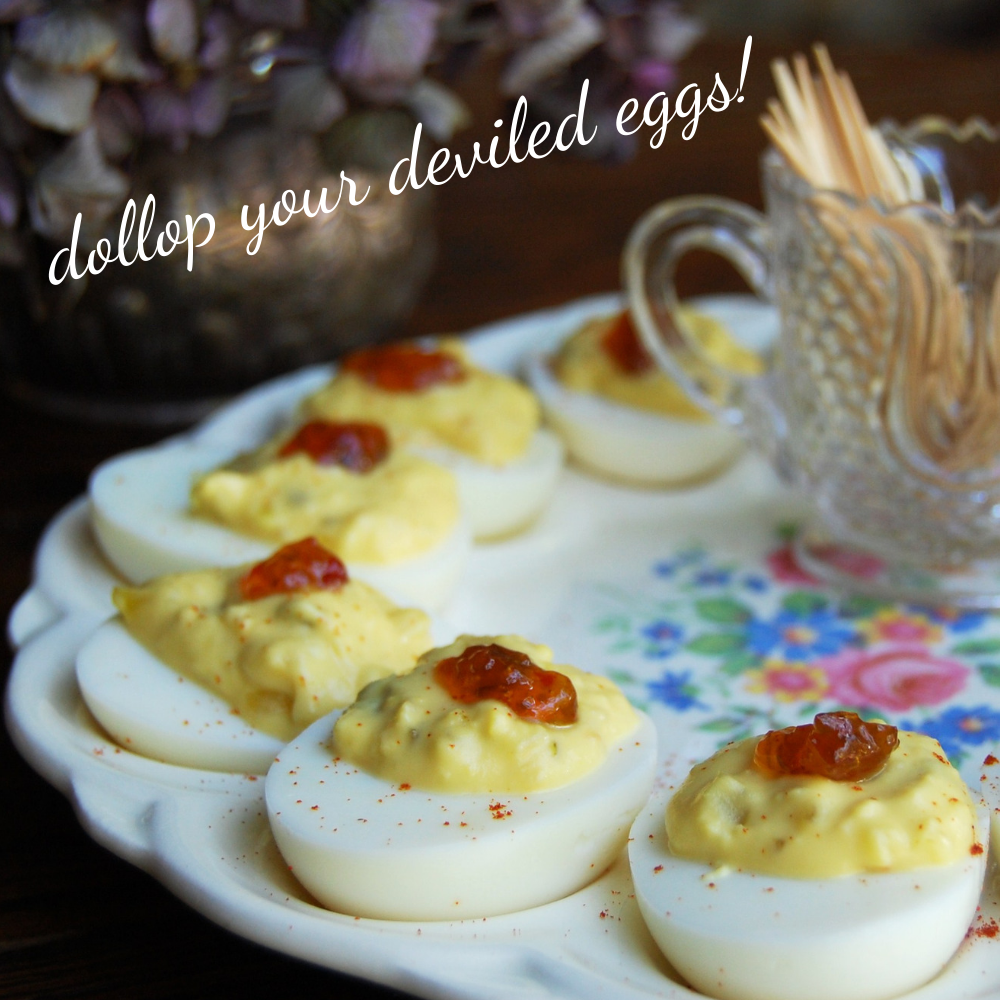 
                  
                    Load image into Gallery viewer, Prepared deviled eggs with dollops of Hell Fire pepper jelly -- served on a floral designed vintage egg dish. Sweet and spicy pepper jelly is a mouthwatering addition to any egg dish. 
                  
                