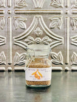 Glass jar filled with Applewood smoked sea salt.