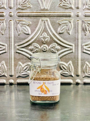 
                  
                    Load image into Gallery viewer, Glass jar filled with Applewood smoked sea salt.
                  
                