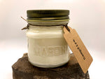 Mason Jar filled with 100 % pure soy wax candle. Campfire is the scent with a gift tag attached.