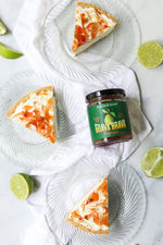 Guava Brava hot pepper jelly jar amongst slices of fresh key lime pie. Sweet and spicy hot guava pepper jam swirled over homemade key lime pie.