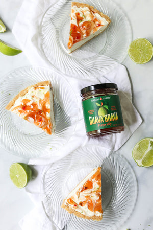 
                  
                    Load image into Gallery viewer, Guava Brava hot pepper jelly jar amongst slices of fresh key lime pie. Sweet and spicy hot guava pepper jam swirled over homemade key lime pie.
                  
                