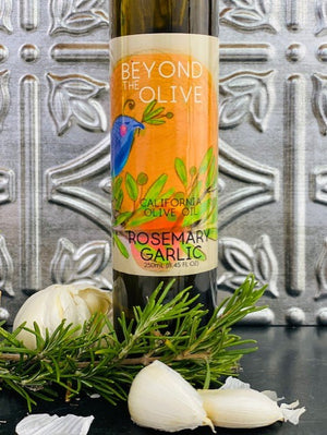 
                  
                    Load image into Gallery viewer, ROSEMARY GARLIC OLIVE OIL BOTTLE PICTURED WITH FRESH GARLIC AND ROSEMARY HERB
                  
                