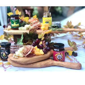 
                  
                    Load image into Gallery viewer, Hand carved wooden serving paddles pictured here with charcuterie offerings. Cheese, grapes, salami with all four flavors of Jenkins Jellies hot pepper jelly. Fiery Figs, Guava Brava, Passion Fire and Hell Fire pepper jellies.
                  
                